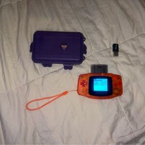 Nintendo Game Boy Advance in Translucent Orange with Purple Case